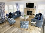 Pleasant Memories living space with plenty of seating and a Smart TV